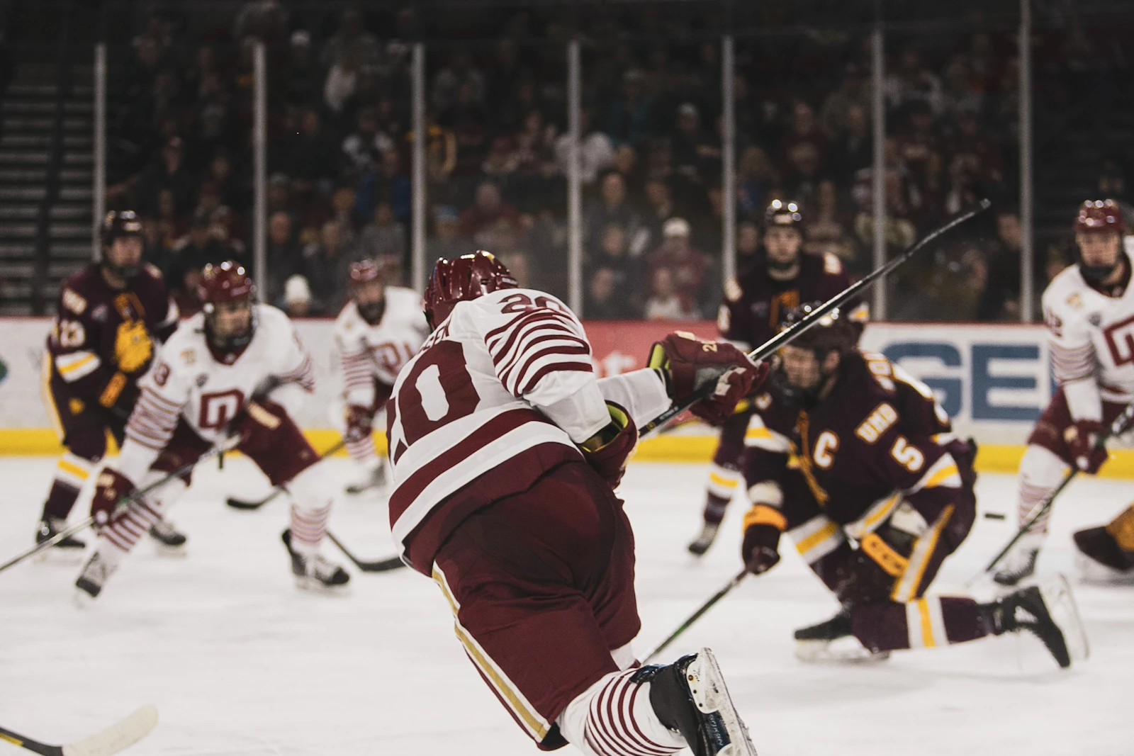 College hockey forwards driving toward the net, illustrating our scouting report on Lundy and Nardella