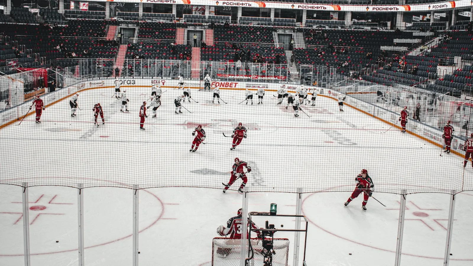 Wide view of a pro hockey game inside a modern arena