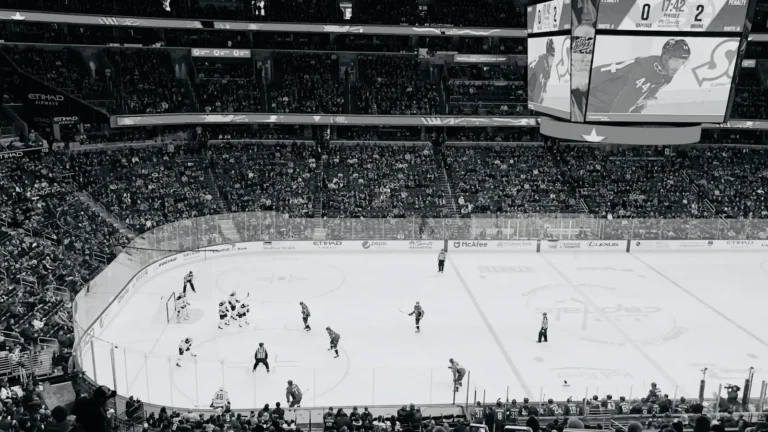 Black and white view of a hockey arena from the upper level