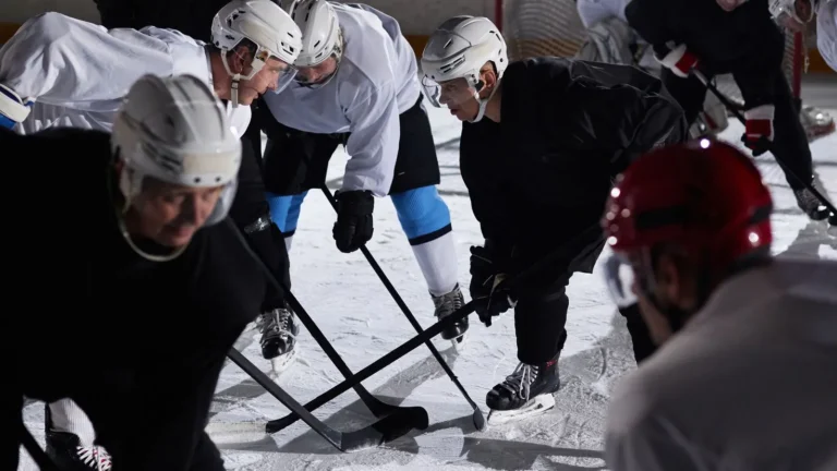 Hockey players running a drill during team practice