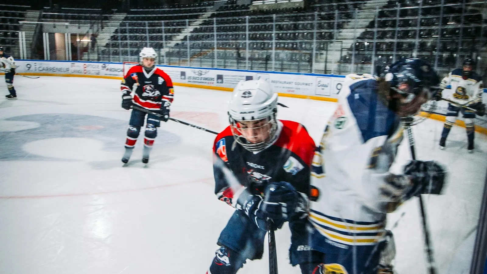 Hockey players competing for the puck during a game